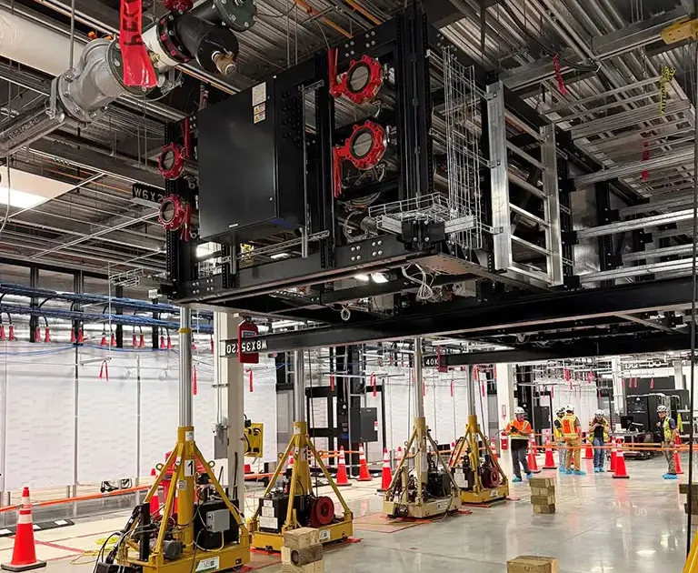 Precision indoor heavy lifting and equipment positioning using hydraulic gantry towers in Manassas, Virginia.